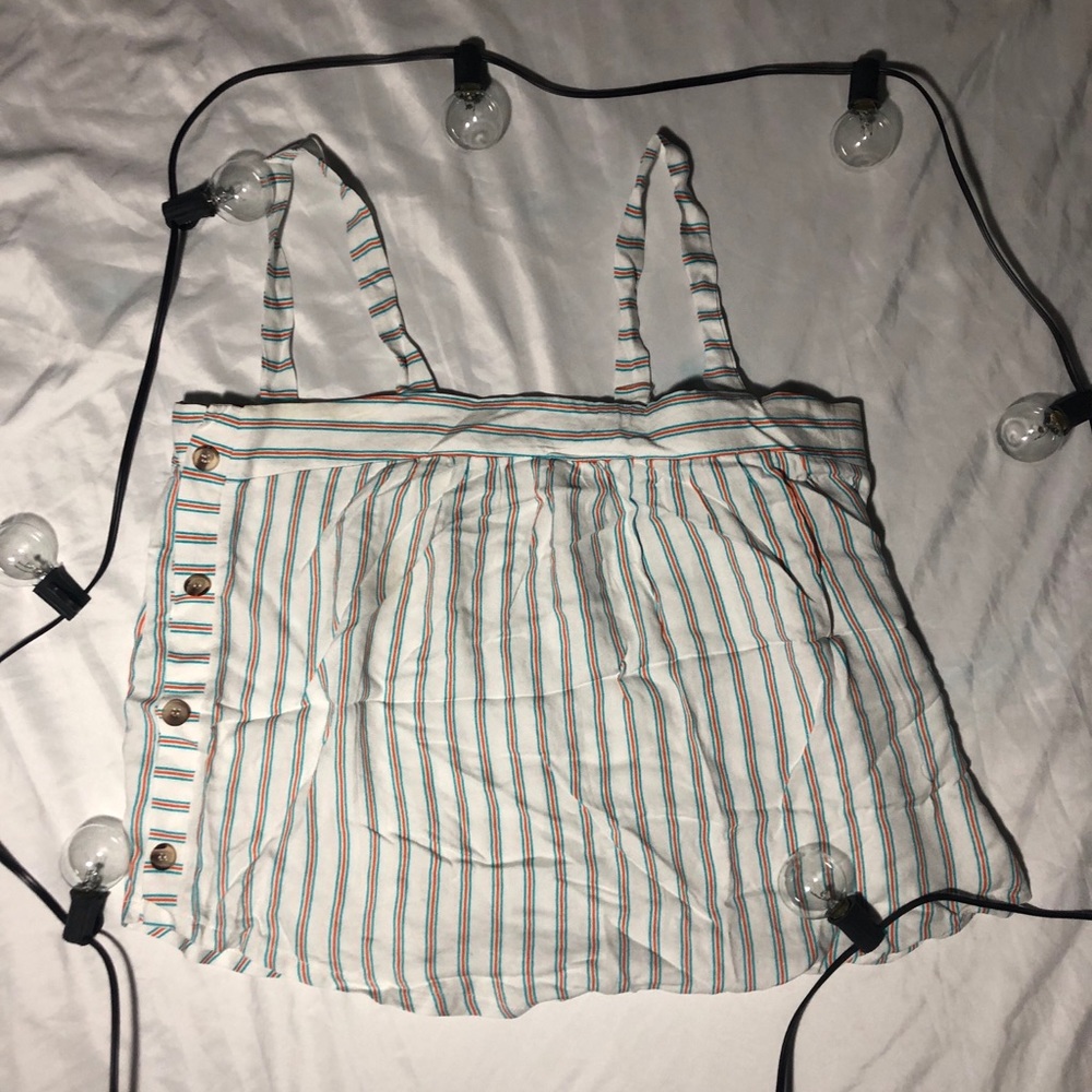 Stripped shirt with buttons on the side.